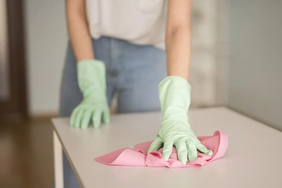 front-view-defocused-woman-cleaning-surface